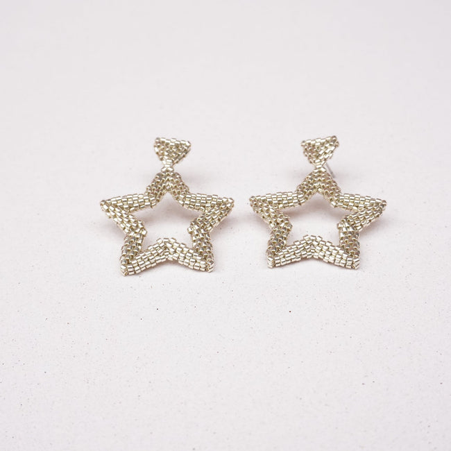 Star-shaped earrings on a white background